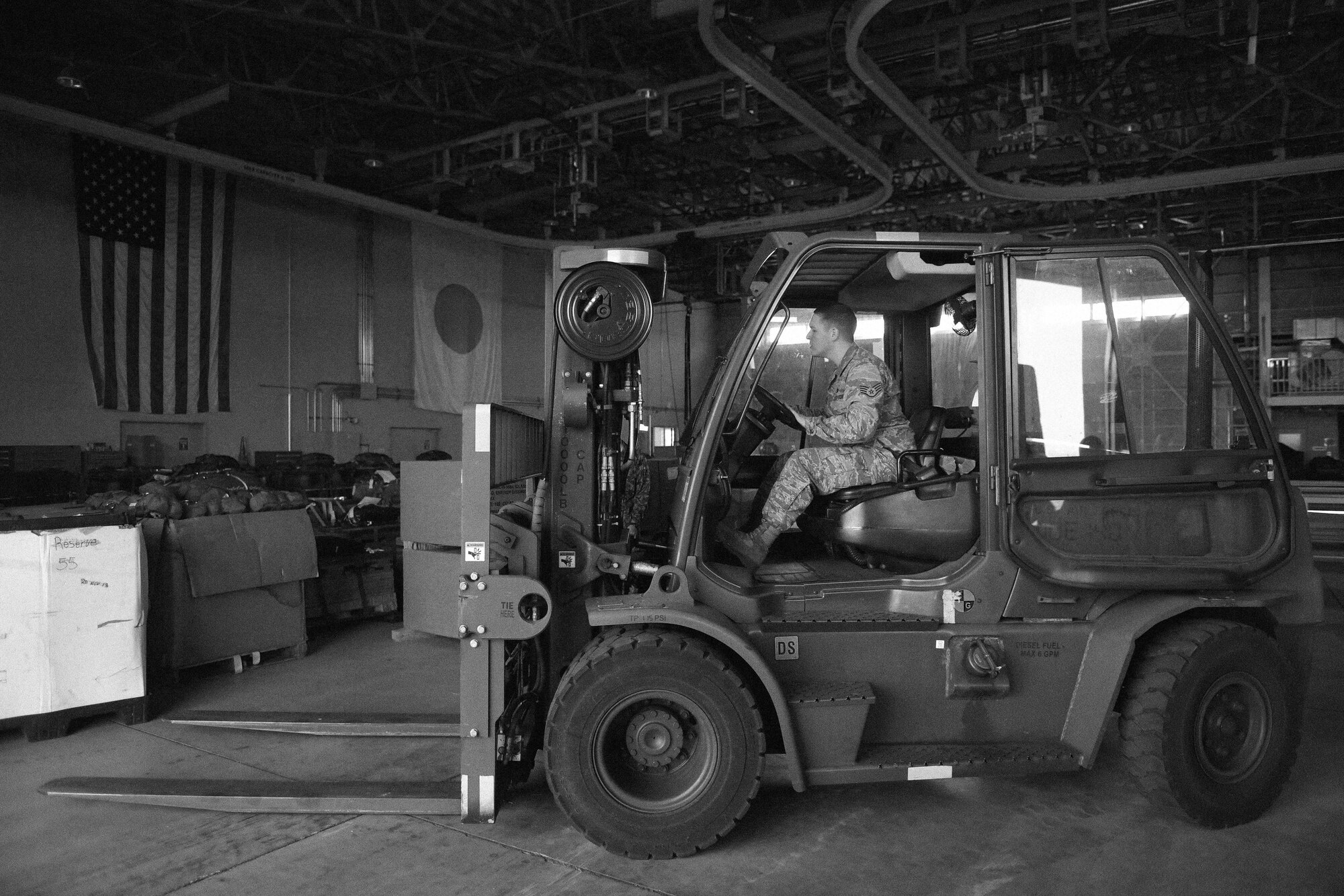 Staff Sgt. William McAtee, 374th Logistics Readiness Squadron combat mobility flight supervisor, prepares to move Japan Ground Self-Defense Force delivery system bundle equipment during Keen Sword 17 at Yokota Air Base, Japan, Nov. 6, 2016. As part of Keen Sword 17, U.S. and Japan Self-Defense Force members participated in C-17 Globemaster III tie-down training, UH-1N Iroquois night flight familiarization and C-130 Hercules container delivery system bundle drops, each designed to increase combat readiness and interoperability within the framework of the U.S.-Japan alliance. (U.S. Air Force photo by Senior Airman Delano Scott/Released)