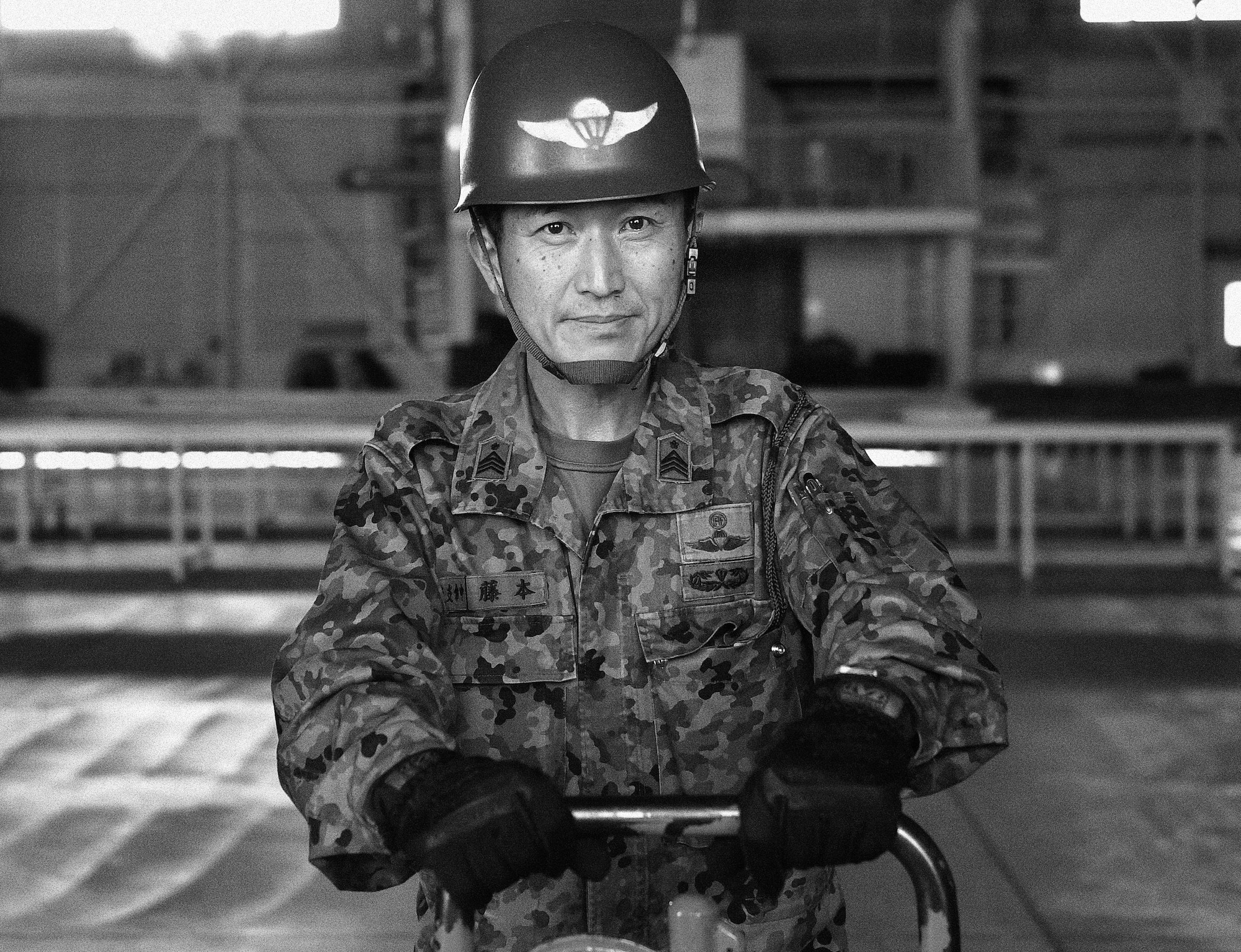 A Japan Ground Self-Defense Force member uses a dolly to move container delivery system bundles during Keen Sword 17 at Yokota Air Base, Japan. Nov. 6, 2016. As part of Keen Sword 17, U.S. and JASDF military members participated in C-17 Globemaster III tie-down training, UH-1N Iroquois night vision goggle hoist training and C-130 Hercules container delivery system bundle drops, each designed to increase combat readiness and interoperability within the framework of the U.S.-Japan alliance. (U.S. Air Force photo by Senior Airman Delano Scott/Released)