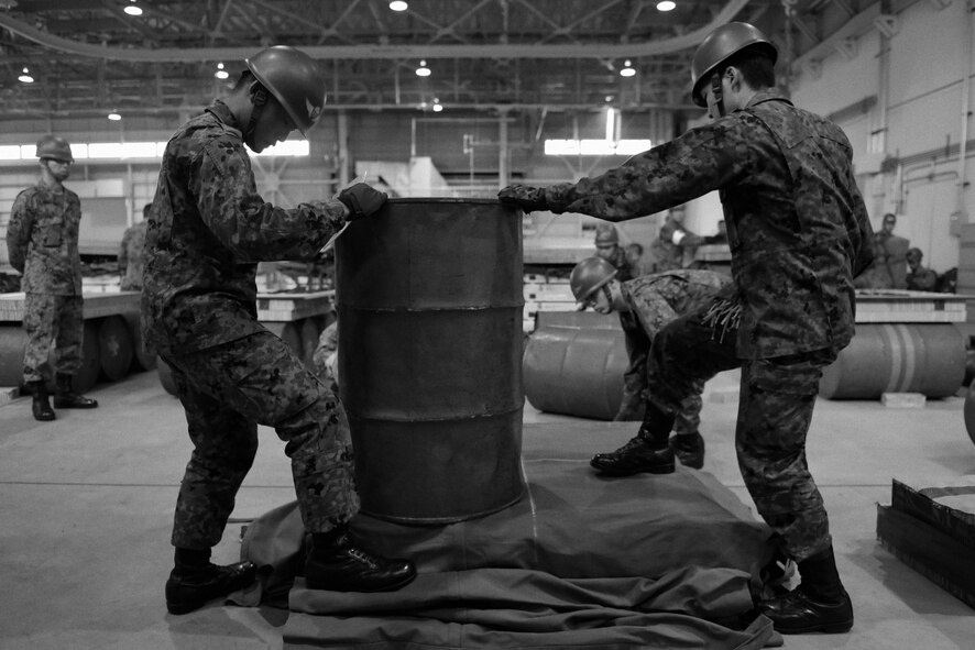Japan Ground Self-Defense Force members prepare to construct a container delivery system bundle at Yokota Air Base, Japan, Nov. 7, 2016. As part of Keen Sword 17, U.S. and Japan Self-Defense Force members participated in C-17 Globemaster III tie-down training, UH-1N Iroquois night flight familiarization and C-130 Hercules container delivery system bundle drops, each designed to increase combat readiness and interoperability within the framework of the U.S.-Japan alliance. (U.S. Air Force photo by Senior Airman Delano Scott/Released)