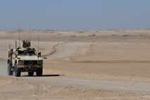Members of the 386th Expeditionary Civil Engineer Squadron Explosive Ordnance Disposal flight drive a mine-resistant ambush-protected vehicle to the safe area at an undisclosed location in Southwest Asia Nov. 9, 2016. The safe area is located approximately 1.4 kilometers from the burn pile. (U.S. Air Force photo by Senior Airman Andrew Park)