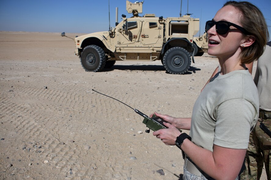 Staff Sgt. Michelle Terrell, 386th Expeditionary Medical Support operation medical technician, shouts “fire in the hole” as she presses the button to initiate the burn process at an undisclosed location in Southwest Asia Nov. 9, 2016. (U.S. Air Force photo by Senior Airman Andrew Park)