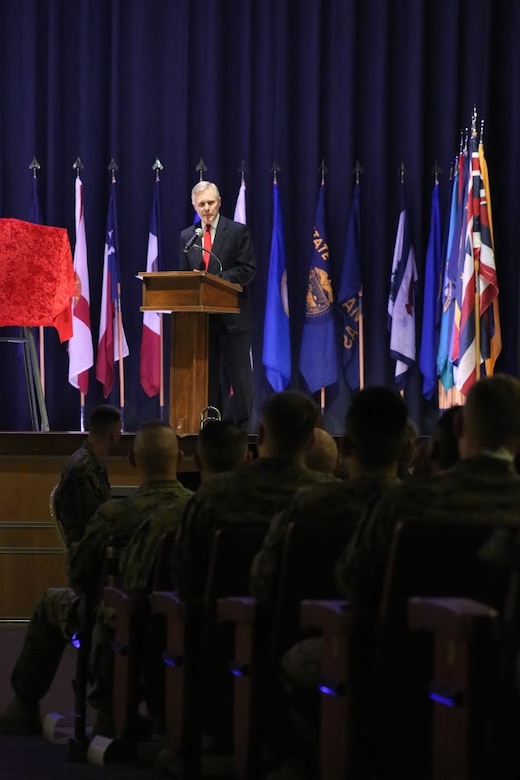 Secretary of the Navy, the Honorable Ray Mabus addresses a crowd during a ceremony at Marine Corps Air Station Cherry Point, N.C., Nov. 9, 2016. During the visit, Mabus announced that the Arleigh Burke-class destroyer, DDG 121, will be named the USS Frank E. Petersen Jr., in honor of the Marine Corps lieutenant general who was the first African-American Marine Corps aviator and Marine Corps general officer. Mabus also awarded MCAS Cherry Point with a certificate of achievement for its Blue level of achievement in the Fiscal Year 2016 SecNav Energy and Water Management Awards, for a well-rounded energy or water program. (U.S. Marine Corps photo by Sgt. N.W. Huertas/ Released) 
