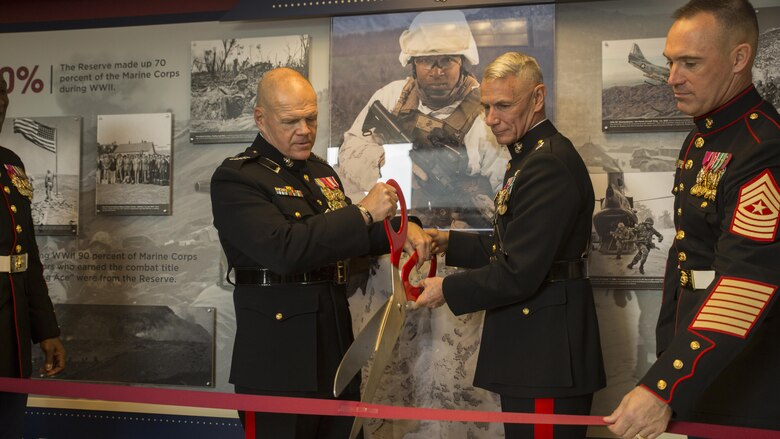 Gen. Robert B. Neller, commandant of the Marine Corps, and Lt. Gen. Rex C. McMillian, commander of Marine Forces Reserve and Marine Forces North, participate in a ribbon-cutting ceremony for the official unveiling of the Marine Corps Reserve Centennial wall display at the Pentagon, Arlington, Va., Nov. 9, 2016. The exhibit was installed at the Pentagon in conjunction with the 100th anniversary of the Marine Corps Reserve, which was celebrated Aug. 29, 2016. For more information on the history and heritage of the Marine Corps Reserve as well as current Marine stories and upcoming Centennial events, please visit www.marines.mil/usmcr100. 