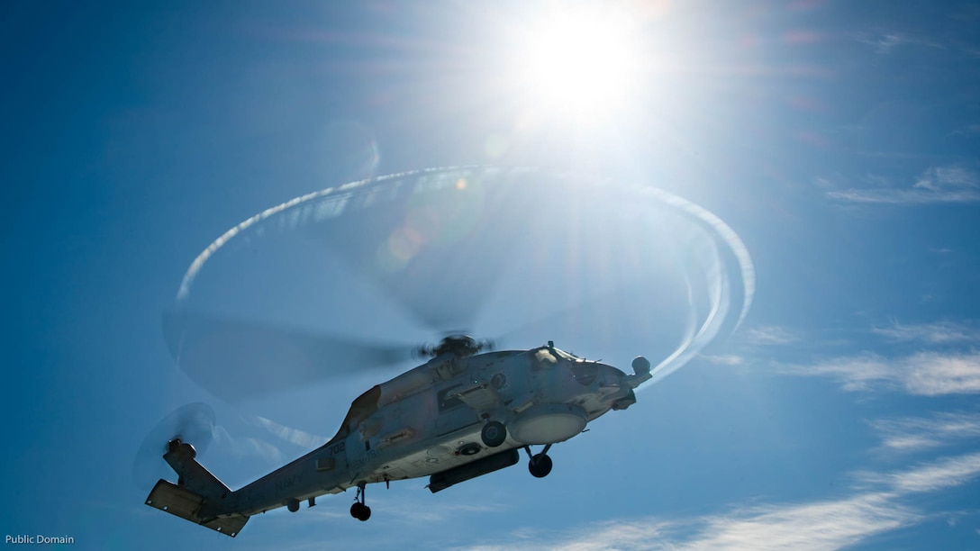 An MH-60R Sea Hawk helicopter from Helicopter Maritime Strike Squadron 78 flies over the aircraft carrier in the Pacific Ocean aboard the USS Carl Vinson flight deck Nov. 11, 2016. Carl Vinson is currently underway conducting Composite Training Unit Exercise in preperation for an upcoming deployment. 
