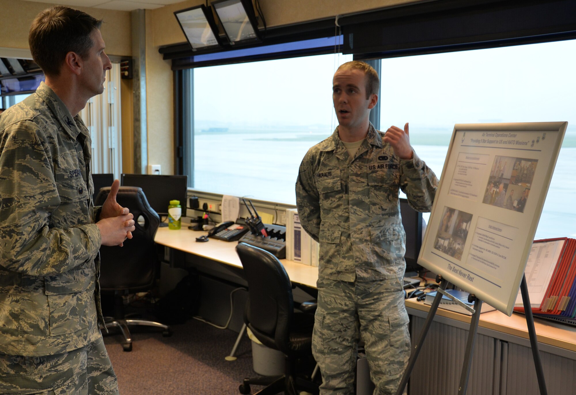 U.S. Air Force Col. Bradley Spears, left, 521st Air Mobility Operations Wing vice commander, speaks to U.S. Air Force Staff Sgt. Daniel Kraus, 727th Air Mobility Squadron information controller, during a tour Nov. 9, 2016, on RAF Mildenhall, England. The leader hoped to gain inside knowledge into Airmen’s needs to carry out the mission, and what leadership could do to assist. (U.S. Air Force photo by Gina Randall)