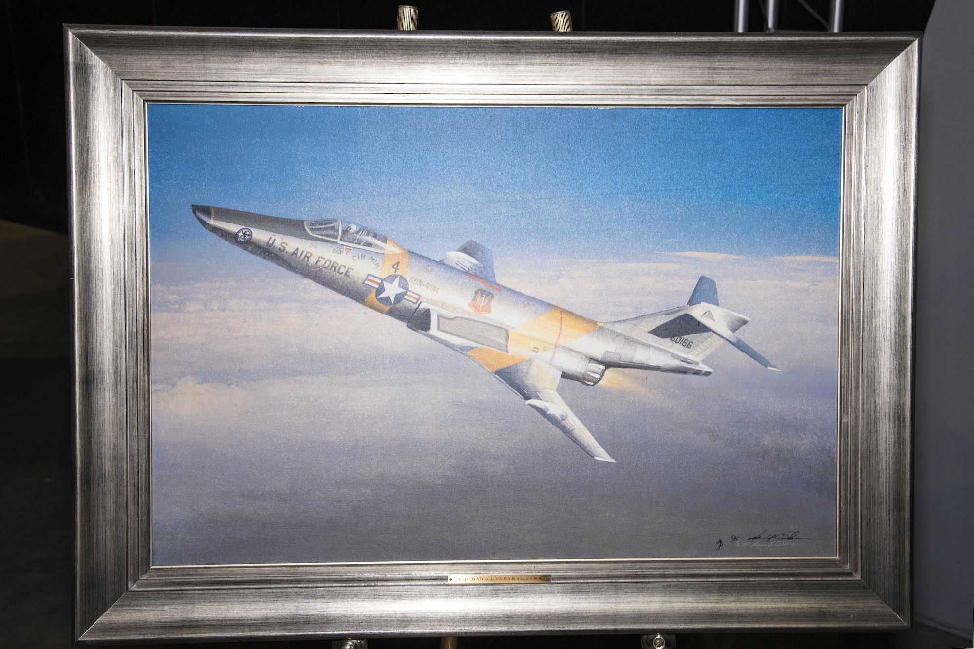 DAYTON, Ohio - A giclee of "Schrek's CIN MIN on the SUN-RUN" by aviation artist William S. Phillips in the Southeast Asia War Gallery at the National Museum of the U.S. Air Force. (U.S. Air Force photo)