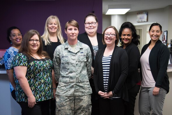 Staff Sgt. Lacey Matthews, 403rd Aircraft Maintainance Squadron crew chief, presents a donation to the Gulf Coast Women's Center for Nonviolence. 403rd Wing members raised more than $1,300 as part of their support of the Green Dot program, which is the U.S. Air Force's program to help raise awareness of and prevent sexual assault, domestic violence and stalking.(U.S. Air Force photo/Staff Sgt. Heather Heiney)