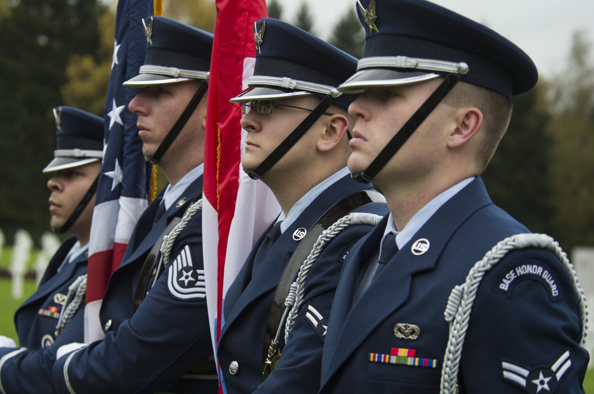 U.S. Air Force Ceremonial Guardsmen stand at attention during a Veterans Day ceremony at the Luxembourg American Cemetery and Memorial in Hamm, Luxembourg City, Luxembourg, Nov. 11, 2016. The American Battle Monuments Commission administers the cemetery which serves as the final resting places of 5,076 American service members. (U.S. Air Force photo by Senior Airman Dawn M. Weber)