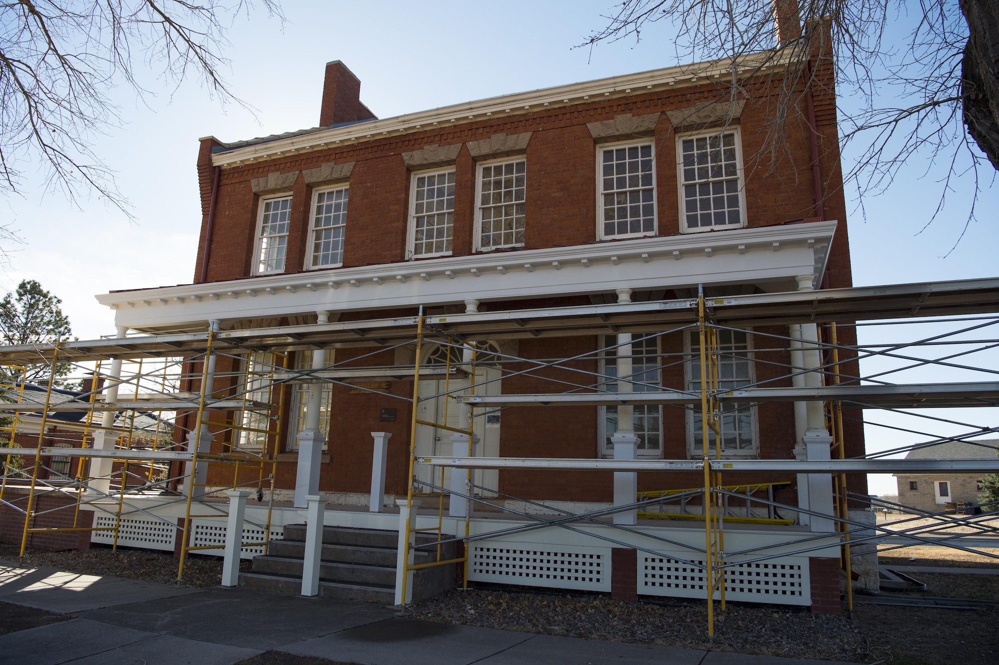 Scaffolding surrounds the outside of Building 210 at F.E. Warren Air Force Base, Wyo., Nov. 2, 2016 to support ongoing construction. Building 210 was the old Army post headquarters and was constructed in 1894 when the base was previously called Fort D.A. Russell. Airmen from the 90th Civil Engineer Squadron have started renovations on the building with an estimated completion date of spring 2017. (U.S. Air Force photo by Staff Sgt. Christopher Ruano)