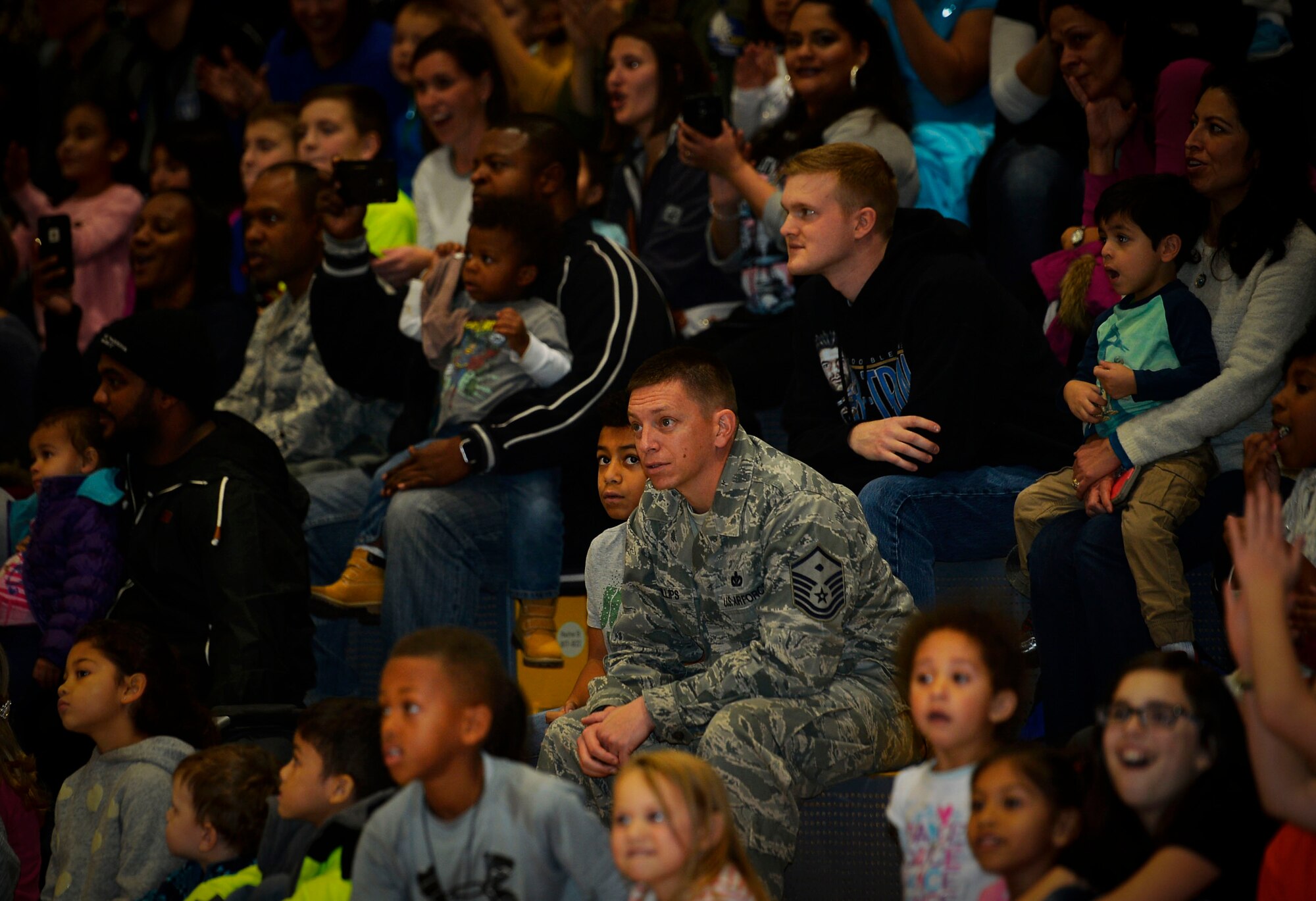 Airmen and their families watch a performance by the Harlem Globetrotters at Ramstein Air Base, Germany, Nov. 10, 2016. The basketball exhibition group has conducted tours for U.S. troops stationed overseas for more than ten years. (U.S. Air Force photo by Airman 1st Class Joshua Magbanua)