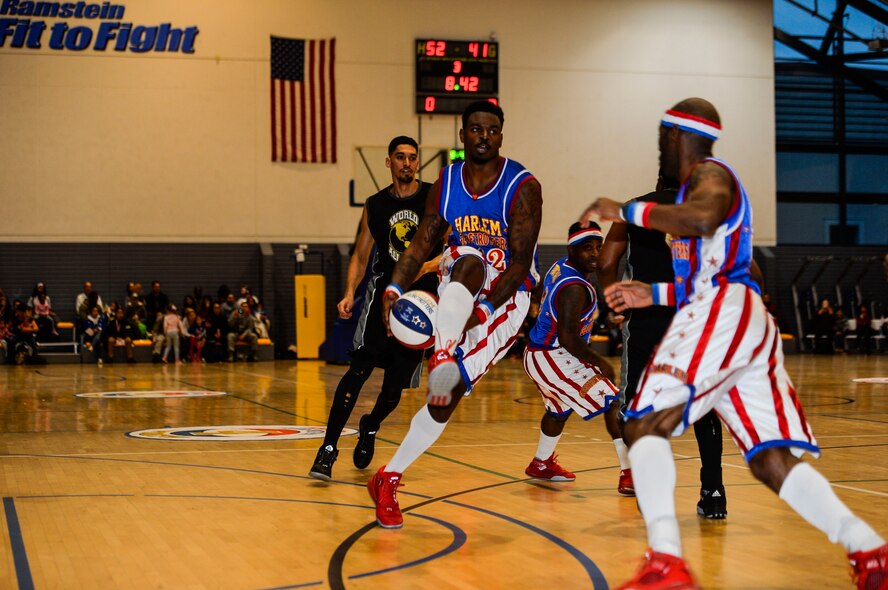 The Harlem Globetrotters play against the World All-Stars at Ramstein Air Base, Germany. The event aimed to boost morale among U.S. troops and their families stationed in the Kaiserslautern Military Community. (U.S. Air Force photo by Airman 1st Class Joshua Magbanua)