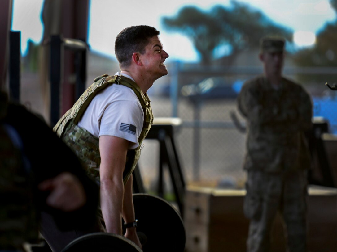 U.S. Air Force Senior Airman Ryan Thomas, 27th Special Operations Civil Engineer Squadron Explosive Ordnance Disposal  technincian, performs hand cleans during the 3rd annual EOD 132 workout Nov. 10, 2016, at Cannon Air Force Base, N.M.. This annual workout is in honor of the 132 EOD technicians who have passed away since the 9/11 tragedy. (U.S. Air Force photo by Staff Sgt. Eboni Reams/Released)
