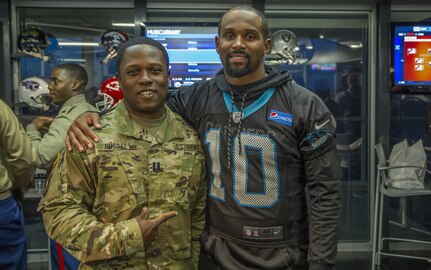 Capt. Jerome Russell, Operations Officer, with the 108th Training Command (Initial Entry Training) hangs out with Corey "Philly" Brown, a Wide Receiver for the Carolina Panthers, during the Pro vs. GI Joe video game challege in Charlotte, N.C., Nov. 7, 2016. (U.S. Army Reserve photo by Sgt. Stephanie A. Hargett/ released)