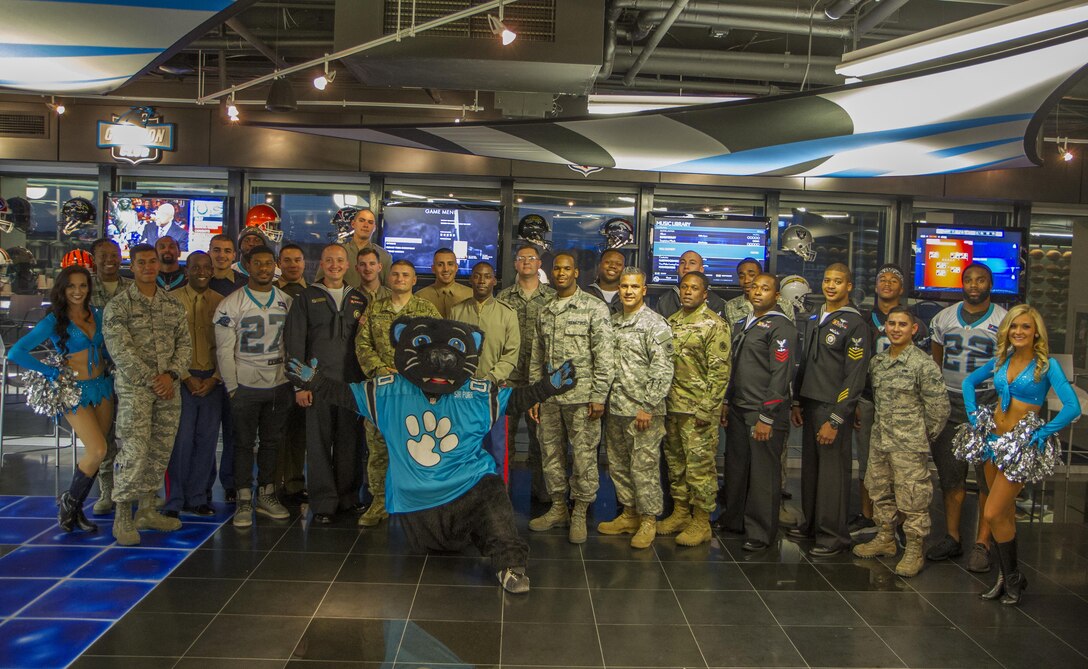 Soldiers, airmen, Marines and sailors, gather with the Carolina Panthers during the Pro vs. GI Joe video game challege in Charlotte, N.C., Nov. 7, 2016. (U.S. Army Reserve photo by Sgt. Stephanie A. Hargett/ released)