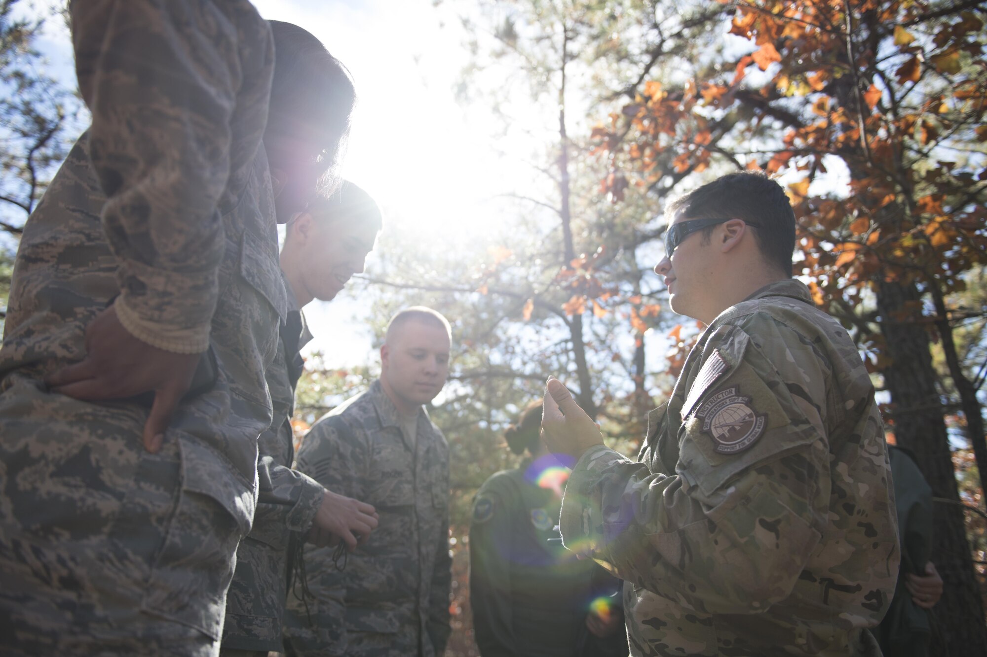 Staff Sgt. Jared Todd, Survival, Escape, Resistance and Escape NCO in charge of operations and training for the 305th Operations Group, teaches and leads Airmen in a SERE exercise at Joint Base McGuire-Dix-Lakehurst, New Jersey, Nov 8, 2016. The exercise took place during the joint Advanced Combat Operations and Tactics exercise. 