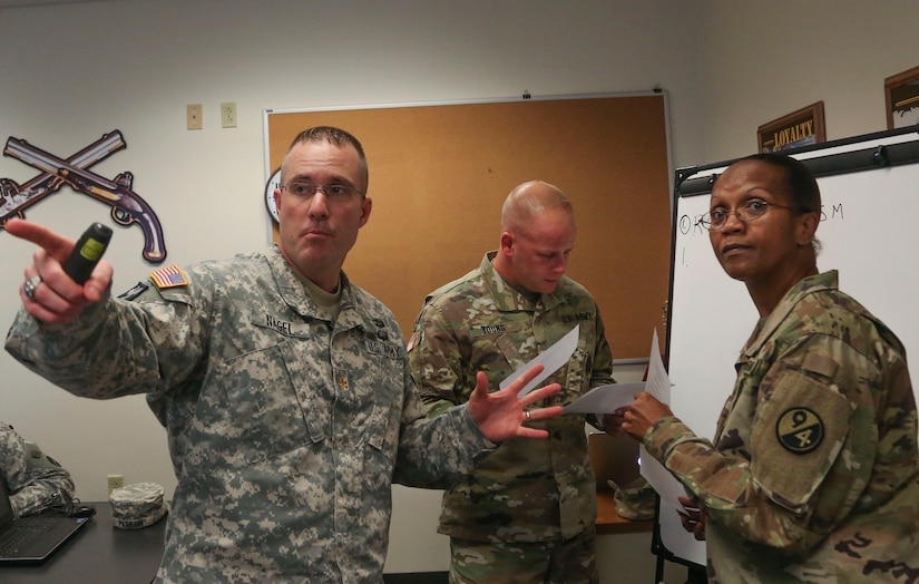 Maj. Jason Nagel, of the 102nd Training Division, teaches a class as part of the 80th Training Command's 2016 Instructor of the Year competition at Fort Knox, Ky., Oct. 22, 2016. Assigned to the 102nd Training Division, Nagel won the Officer IOY and earned the Army Achievement Medal. Photo taken by Spc. Sarah Ruiz, 55th Signal Company (Combat Camera).