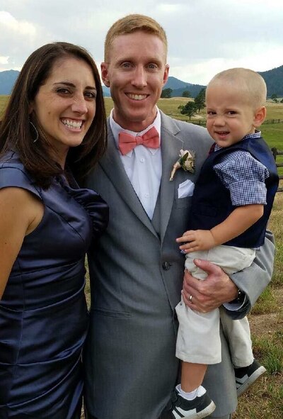 Maj. Chad and Capt. Kate Evans with son, Ash, at their wedding.