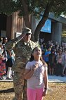 Staff Sgt. Juan Martinez (left), senior human resource specialist, 63rd RSC and fourth grader Amy Pietromonaco render honors during a flag raising ceremony, Nov. 10, Christa McAuliffe Elementary School, Saratoga, Calif. (U.S. Army Reserve photo by Alun Thomas, 63rd RSC Public Affairs)