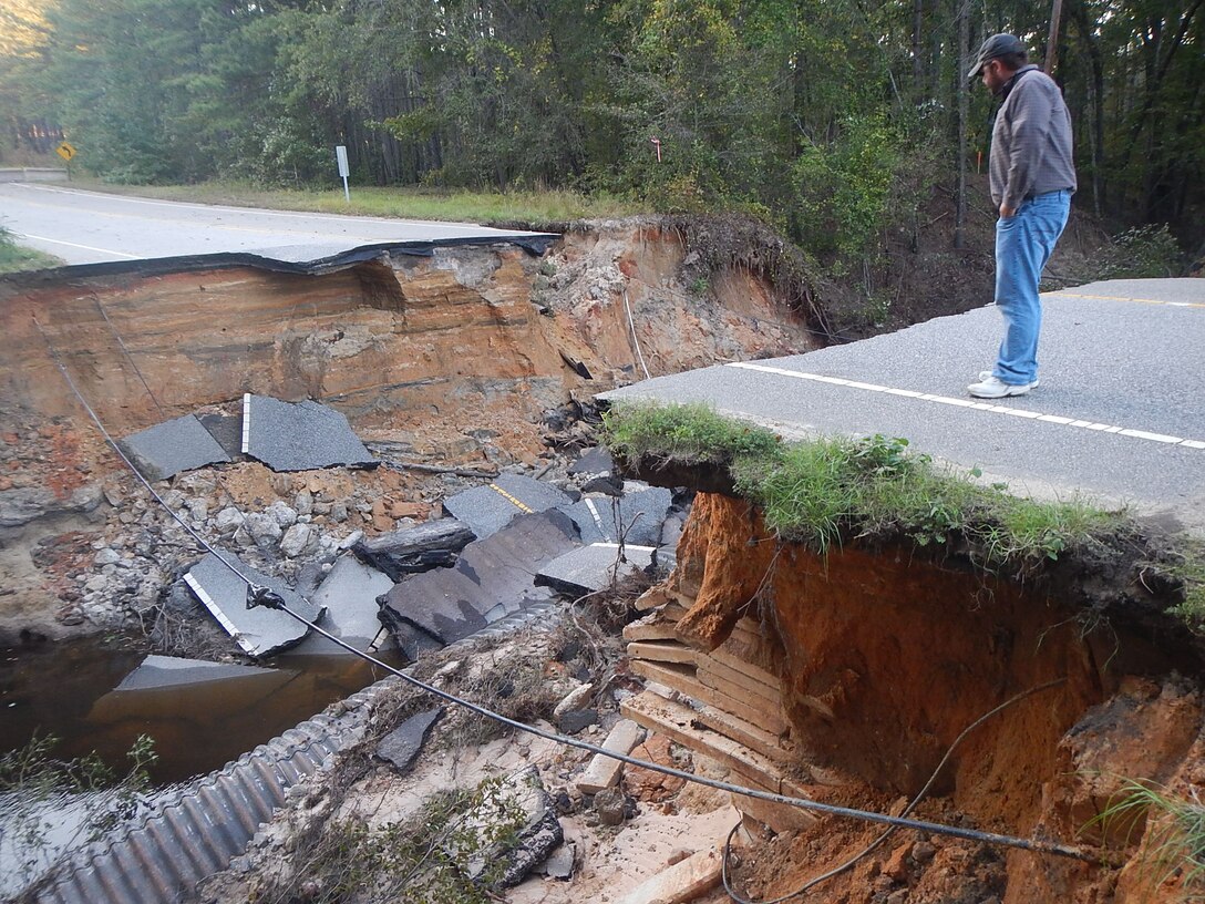 Patrick Hager, a Savannah District structural engineer, inspects a water crossing that failed due to flooding on Fort Bragg in North Carolina Oct. 13, 2016. 