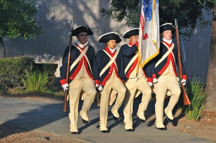 The 63rd Regional Support Command Ceremonial Color Guard marches while practicing for a flag raising ceremony, Nov. 10, Christa McAuliffe Elementary School, Saratoga, Calif. (U.S. Army Reserve photo by Alun Thomas, 63rd RSC Public Affairs)