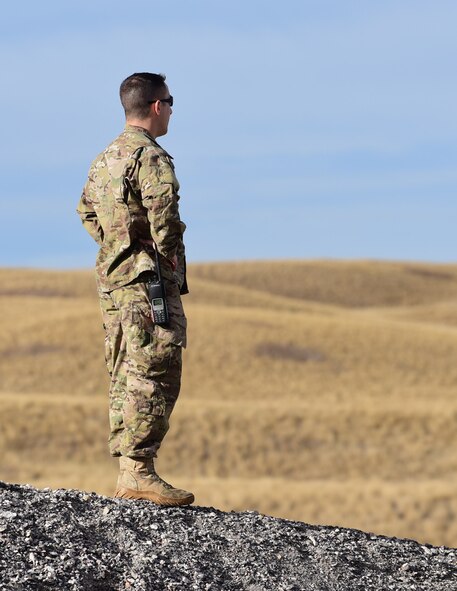 Master Sgt. Carlos Sanchez, explosive ordinance disposal sections chief assigned to the 28th Civil Engineer Squadron, oversees a controlled explosion training exercise at Ellsworth Air Force Base, S.D., Nov. 14, 2016. EOD conducts training to maintain readiness for expeditionary missions. (U.S. Air Force photo by Airman 1st Class James L. Miller)