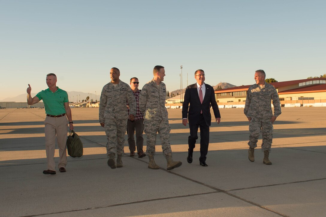 Defense Secretary Ash Carter, second from right, walks with senior leaders after arriving at March Air Reserve Base near Riverside, Calif., Nov. 14, 2016. Carter is on a domestic trip focusing on the readiness of the nation's force and the effectiveness of the warfighter's training and equipment. DoD photo by Army Sgt. Amber I. Smith