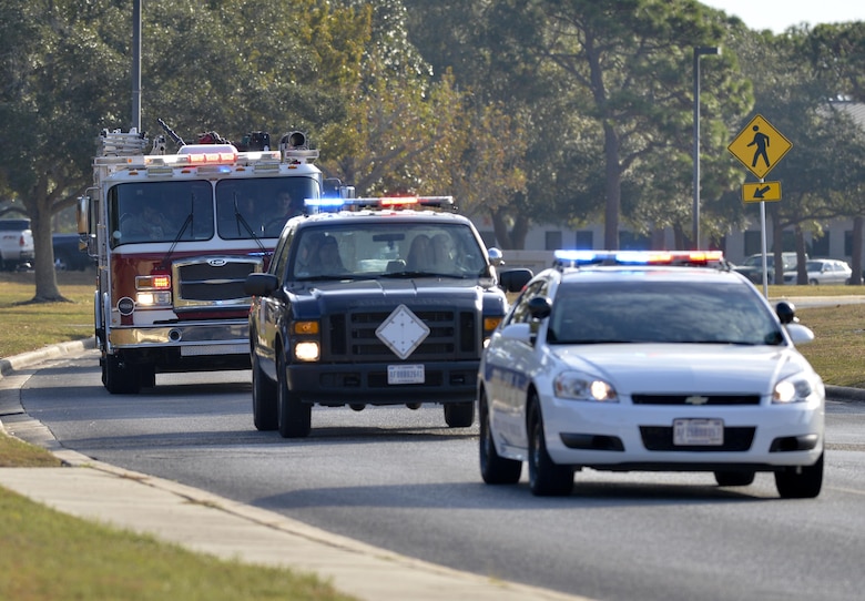 Retired U.S. Air Force Military Working Dog, Mica T204, is escorted to the Tyndall Veterinary Clinic during her final patrol Nov. 14, 2016 at Tyndall Air Force Base. Mica served with the 325th Security Forces Squadron and supported Operations Iraqi Freedom, New Dawn, Enduring Freedom, and Inherent Resolve. (U.S Air Force photo by Tech. Sgt. Javier Cruz/Released)