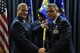 Col. Richard Saunders, right, receives the 302nd Mission Support Group guidon from Col. James DeVere, 302nd Airlift Wing commander, during an assumption of command ceremony for the group at Peterson Air Force Base, Colo., Oct. 15, 2016. (U.S. Air Force photo/1st Lt. Stephen J. Collier)