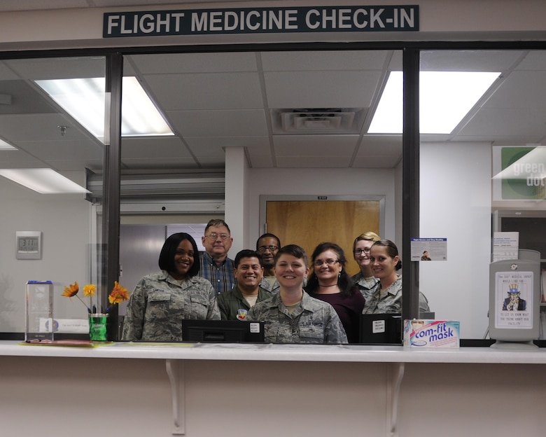 Members of the 325th Aerospace Medicine Squadron flight medicine section gather for a photo Oct. 25, 2016. The flight medicine section is divided into two sections: the base operational medicine clinic, which focuses on the administrative aspect of medical needs, and the flight operational clinic, which focuses on the physical examinations. Both sections work in tandem to ensure the medical deployment readiness of Tyndall Airmen. (U.S. Air Force photo by Senior Airman Solomon Cook/Released)