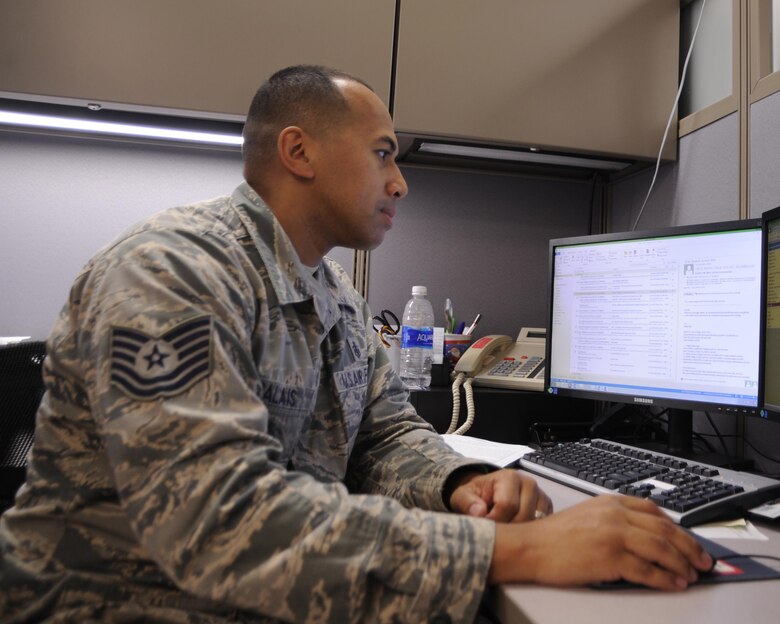 U.S. Air Force Tech. Sgt. Allen Calais, 325th Aerospace Medicine Squadron NCO in charge of the base operational medicine clinic, reviews data updates for incoming physical health assessments Oct. 25, 2016. The base operational medical clinic is a new subsection within the 325th AMDS that focuses on the administrative portion of PHAs. (U.S. Air Force photo by Senior Airman Solomon Cook/Released)