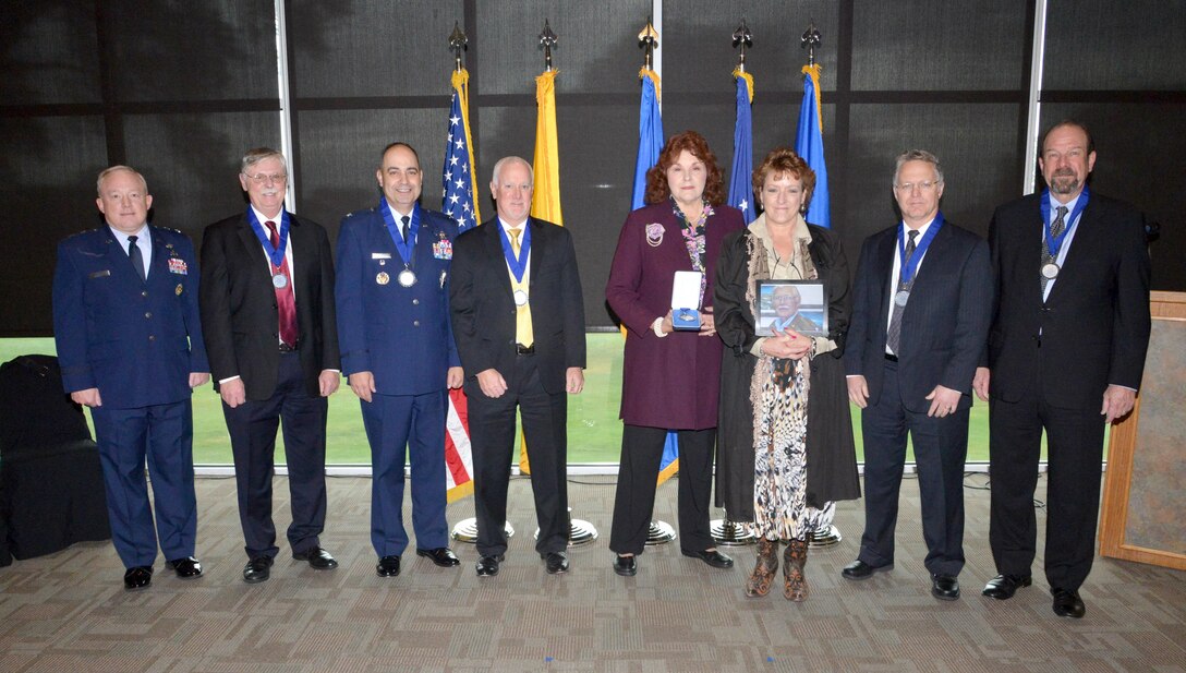 From left, Air Force Nuclear Weapons Center Commander Maj. Gen. Scott Jansson; Order of the Nucleus inductees Donald Cook, AFNWC Vice Commander Col. George Farfour and Eric Single; Eileen Ball and Katrina Benjamin, representing their father, inductee Benjamin Benjamin; and inductees Jeffrey Bean and James “Al” Moyers pose for a photo before the induction ceremony Friday. 