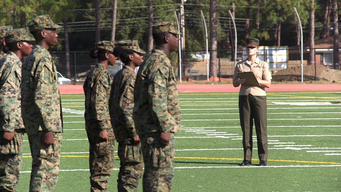 Staff Sgt. Aleena Canto, supply chief, Maintenance Management Center, Marine Corps Logistics Command, judges an unarmed Marine Corps Junior Reserved Officer Training Corps drill competition at Monroe High School, Albany, Ga., Nov. 3.

