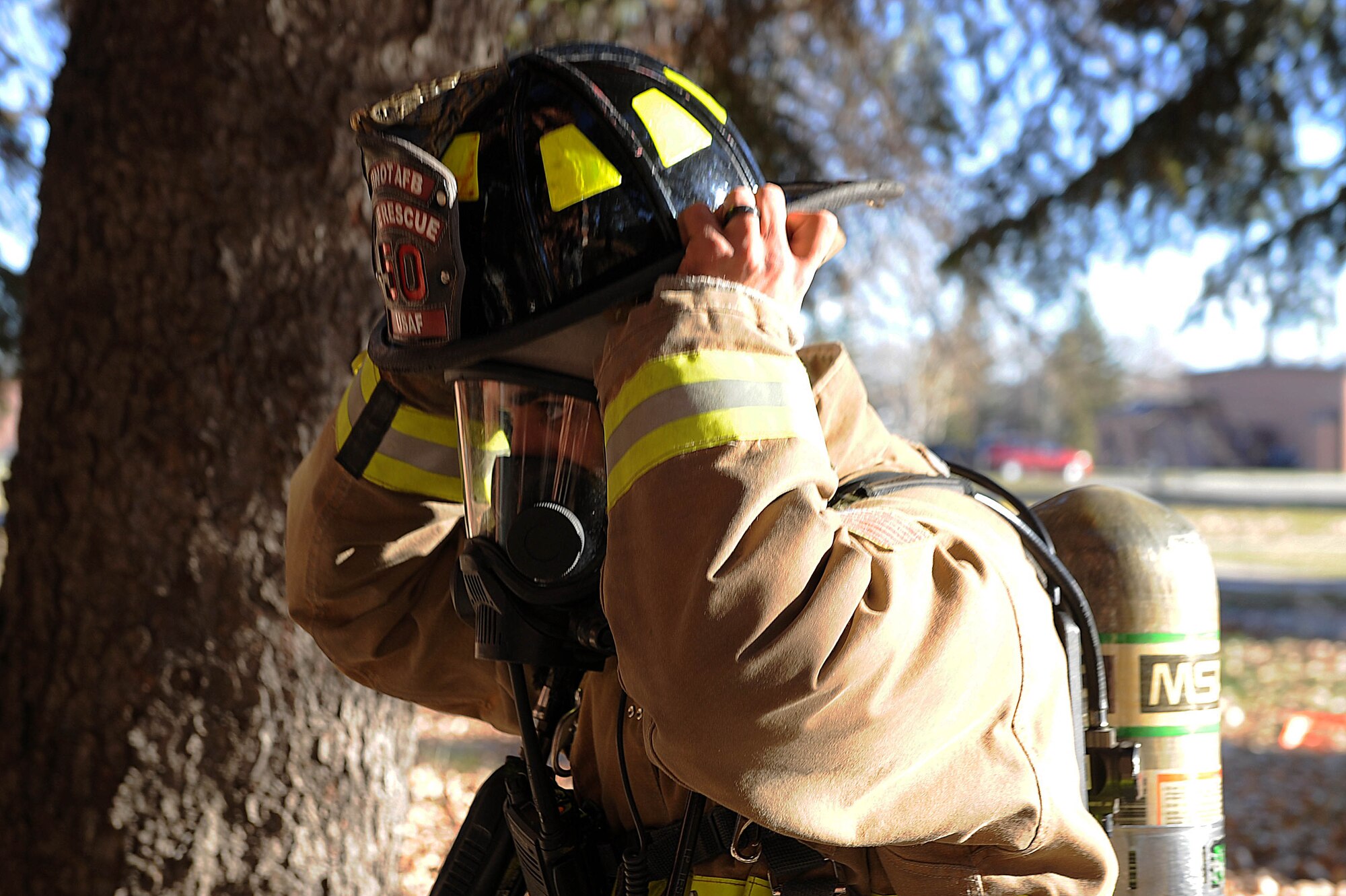 Airman 1st Class Roberto Vazquez, 5th Civil Engineer Squadron firefighter, dons his gear during a training exercise at Minot Air Force Base, N.D., Nov. 9, 2016. The fire protection flight trains on a daily basis for any fire related emergencies. (U.S. Air Force photo/Senior Airman Kristoffer Kaubisch)