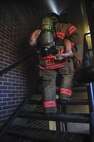 Airman 1st Class Benjamin Cox, 5th Civil Engineer Squadron firefighter, carries a dummy during a training exercise at Minot Air Force Base, N.D., Nov. 9, 2016. The Fire Protection flight routinely trains to help protect people, property and the environment from fires on base. (U.S. Air Force photo/Airman 1st Class Christian Sullivan)