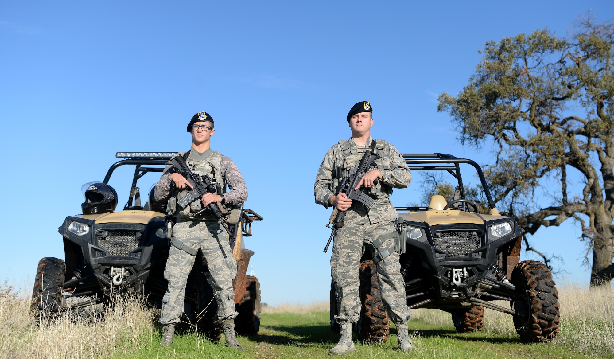 Airman 1st Class Luis Valentin, 9th Security Forces Squadron installation entry controller, and Senior Airman David Gill, 9th SFS base defense operation controller pause during a coyote run Nov. 4, 2016, at Beale Air Force Base, California. Security forces' personnel patrol the perimeter of the base at least once per shift. (U.S. Air Force photo/Airman Tristan D. Viglianco)