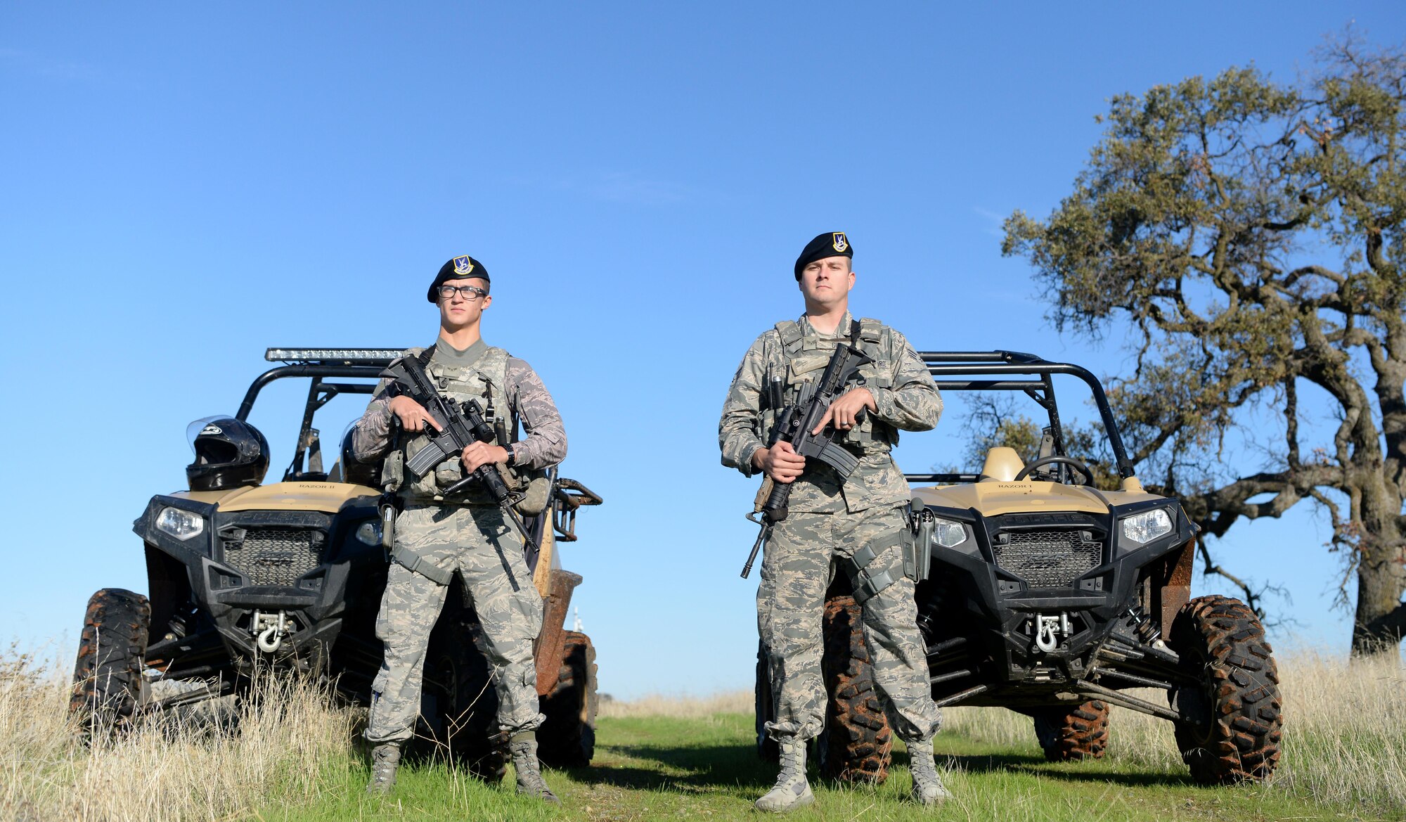 Airman 1st Class Luis Valentin, 9th Security Forces Squadron installation entry controller, and Senior Airman David Gill, 9th SFS base defense operation controller pause during a coyote run Nov. 4, 2016, at Beale Air Force Base, California. Security forces' personnel patrol the perimeter of the base at least once per shift. (U.S. Air Force photo/Airman Tristan D. Viglianco)