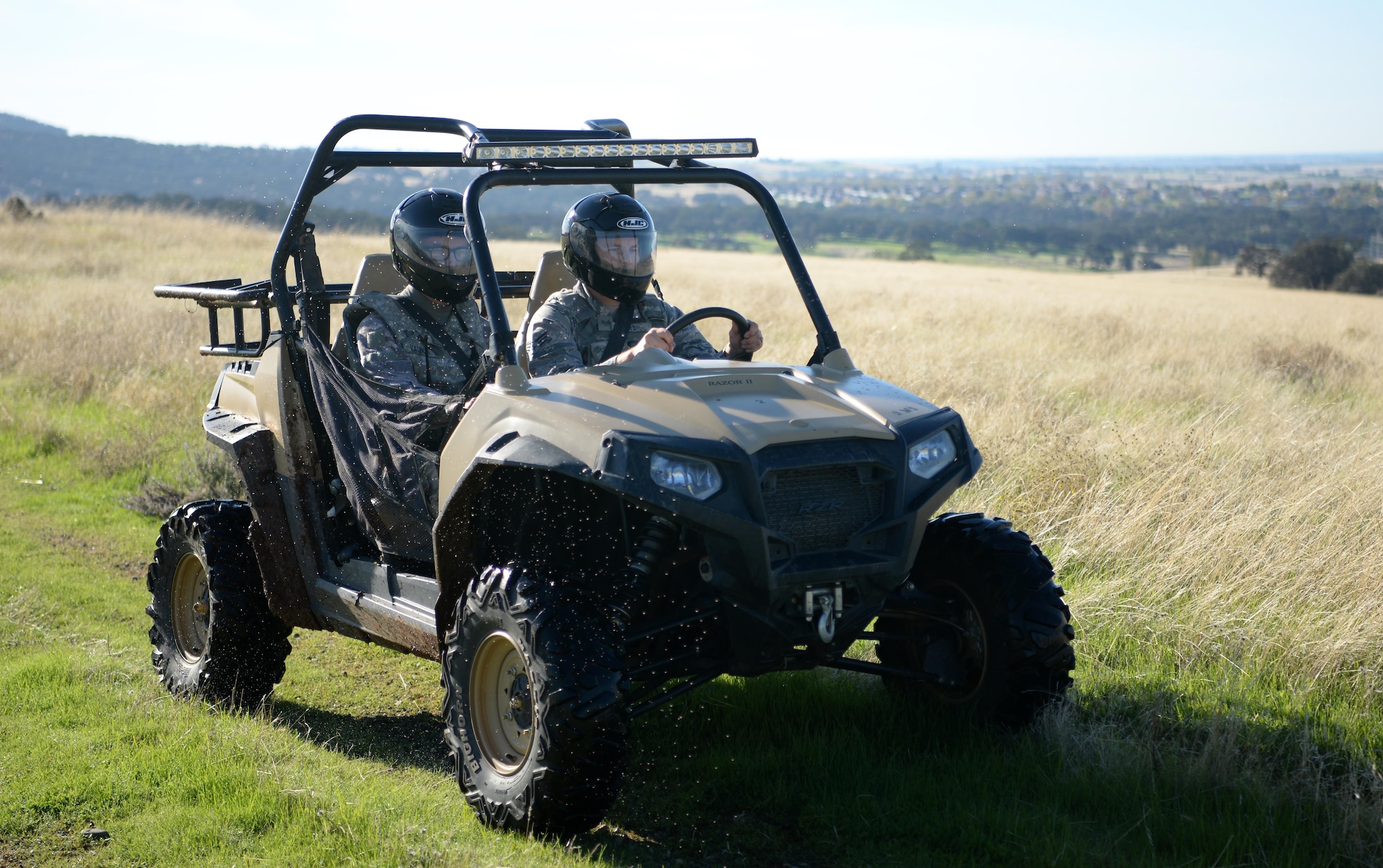 Senior Airman David Gill, 9th Security Forces Squadron base defense operation controller, and Airman 1st Class Luis Valentin, 9th SFS installation entry controller, patrol the installation perimeter in an all-terrain vehicle Nov. 4, 2016, at Beale Air Force Base, California. The patrols in the all-terrain vehicles are known as coyote patrols. (U.S Air Force photo/Airman Tristan D. Viglianco)