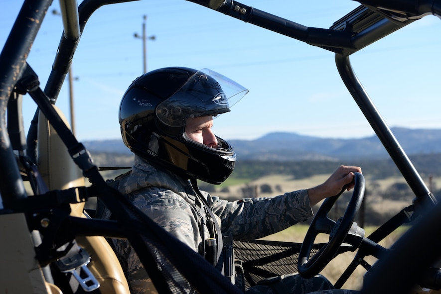 Senior Airman David Gill, 9th Security Forces Squadron base defense operation controller, drives an all-terrain vehicle on the outskirts of Beale Air Force Base, California, Nov. 4, 2016. On the patrols personnel check for intruders and damage to the installation perimeter. (U.S. Air Force photo/Airman Tristan D. Viglianco) 