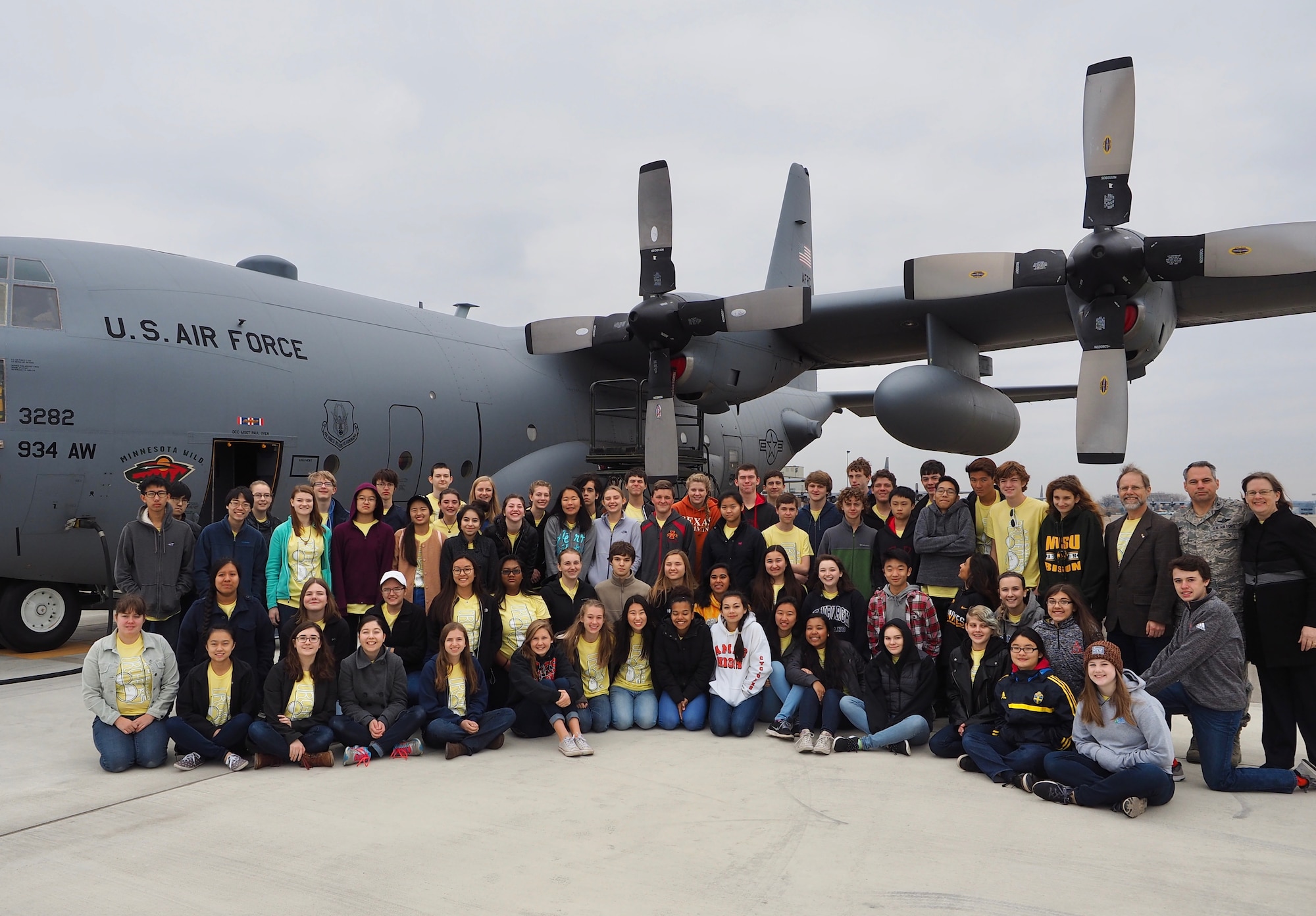 Members of the Ames High School orchestra pose next to a 934th Airlift Wing C-130 after a tour of the aircraft Nov. 14.        