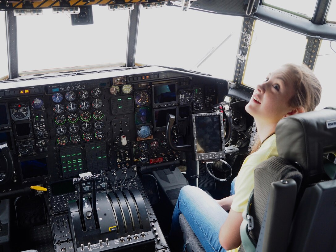 A member of the Ames High School orchestra from Ames, Iowa, gets a close up look at cockpit inside a 934th Airlift Wing C-130.         