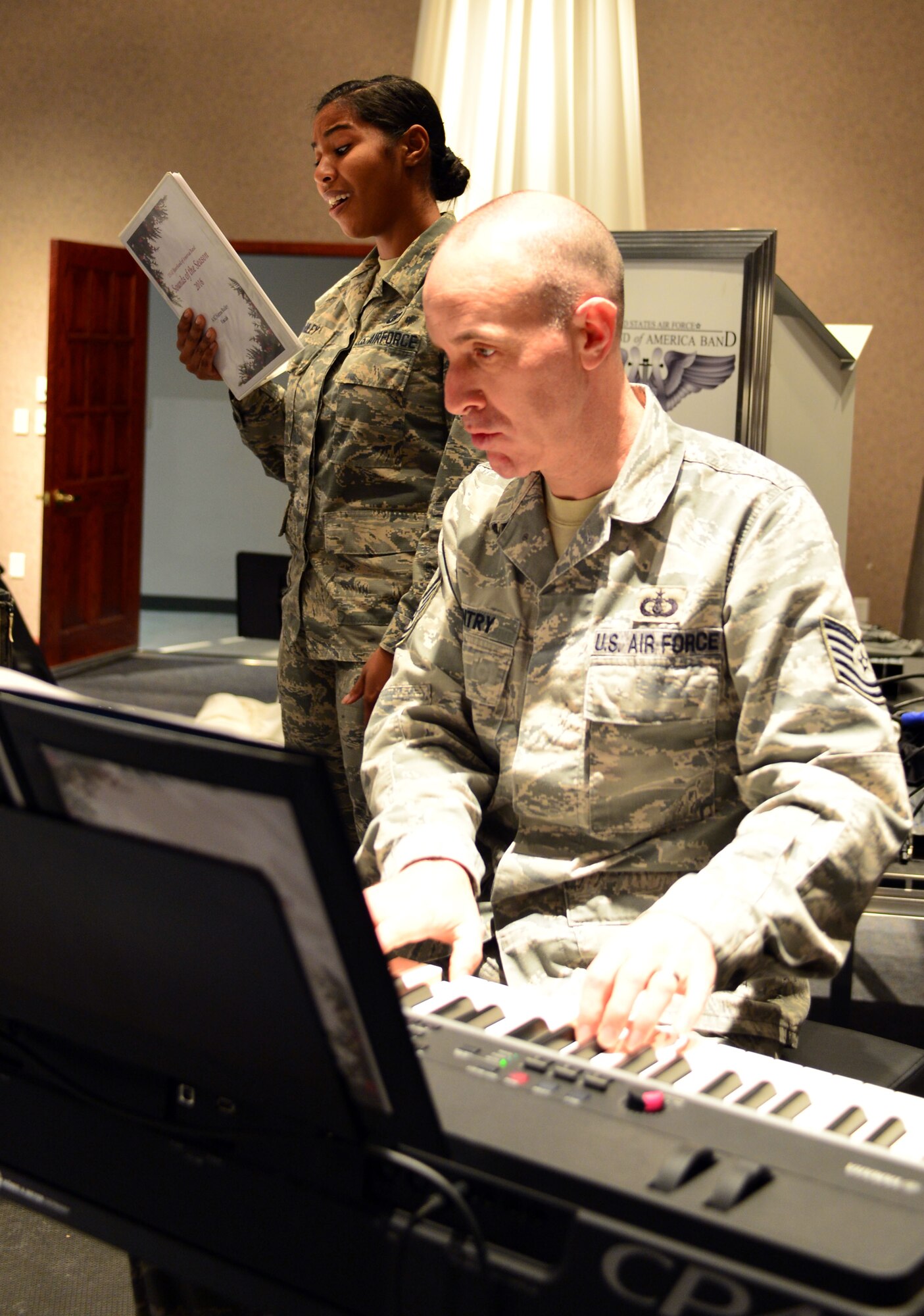 Heartland of America Band members Tech. Sgt. Marshall Gentry and Senior Airman Sierra Bailey rehearse Nov. 15, 2016 at Offutt Air Force Base in preparation for the band's upcoming holiday concert series. The 16-piece band is scheduled to conduct four free holiday-themed performances in the local community starting Dec. 10 and ending Dec. 18, 2016.The series will kick-off with a performance Dec. 10 at 2 p.m. at the Glenwood Community High School Performing Arts Center in Glenwood, Iowa and is presented in partnership with the Glenwood-Opinion Tribune and the Glenwood Community School District. The band will perform again Dec. 16 at 7:30 p.m.; Dec. 17 at 7:30 p.m. and Dec. 18 at 2 p.m. at Bellevue East High School in Bellevue, Nebraska in the school’s auditorium and is presented in partnership with Suburban Newspapers. Information on how to get tickets for these free concerts will be posted soon on the band's website (www.heartlandofamericaband.af.mil) and Facebook page (search for USAF Heartland of America Band) as well as in ads in the Omaha World-Herald, Bellevue Leader and Glenwood Opinion-Tribune newspapers.