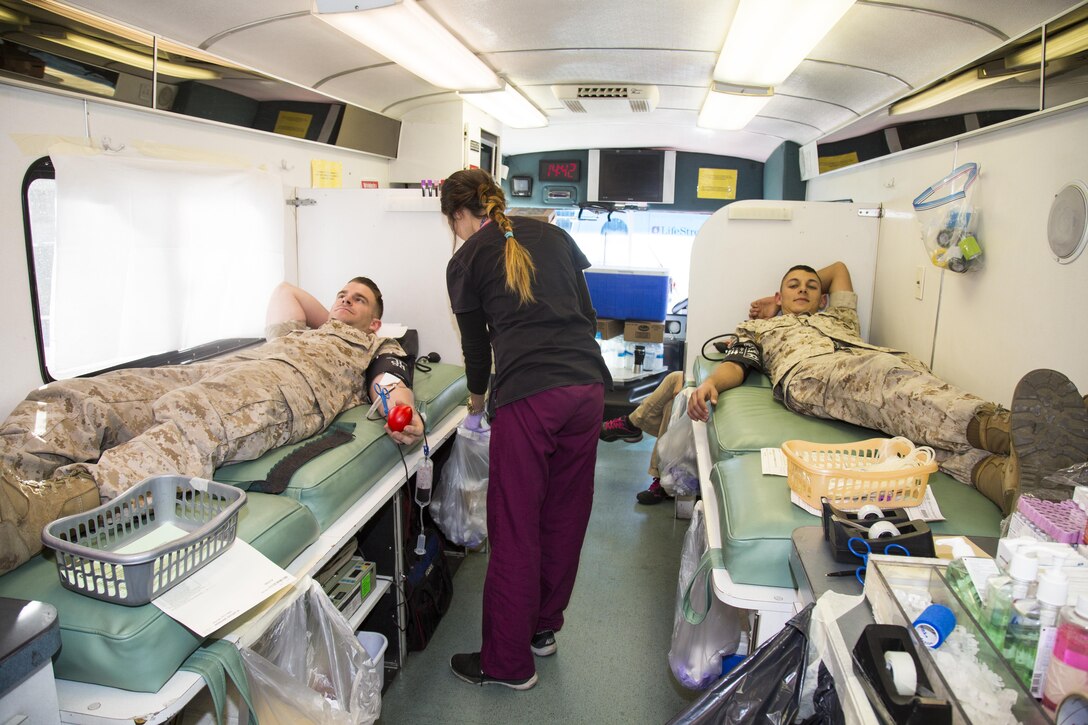 Marines Sgt. Zachary Ingraham, platoon sergeant, and Lance Cpl. Jacob Soto, calibration technician, donate blood during the annual LifeStream blood drive held aboard Marine Corps Logistics Base Barstow, Calif., Nov. 3. The blood drive is yet another way that Marines serve their country and their community. 