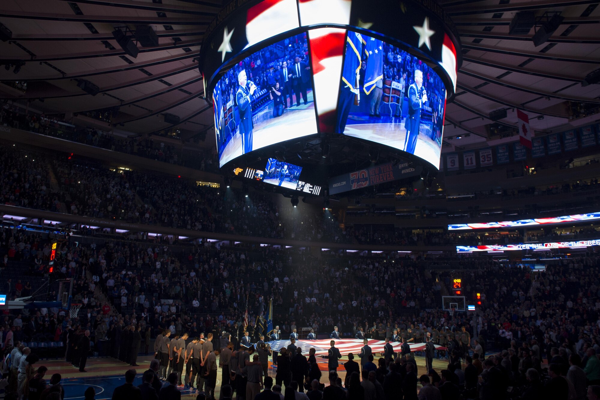 Members of the U.S. Air Force Honor Guard Drill Team present colors and hold the American flag during the National Anthem before the New York Knicks game at Madison Square Garden in New York, Nov. 9, 2016. The drill team was later featured during halftime as part of a Knicks military appreciation night. (U.S. Air Force photo by Senior Airman Philip Bryant)