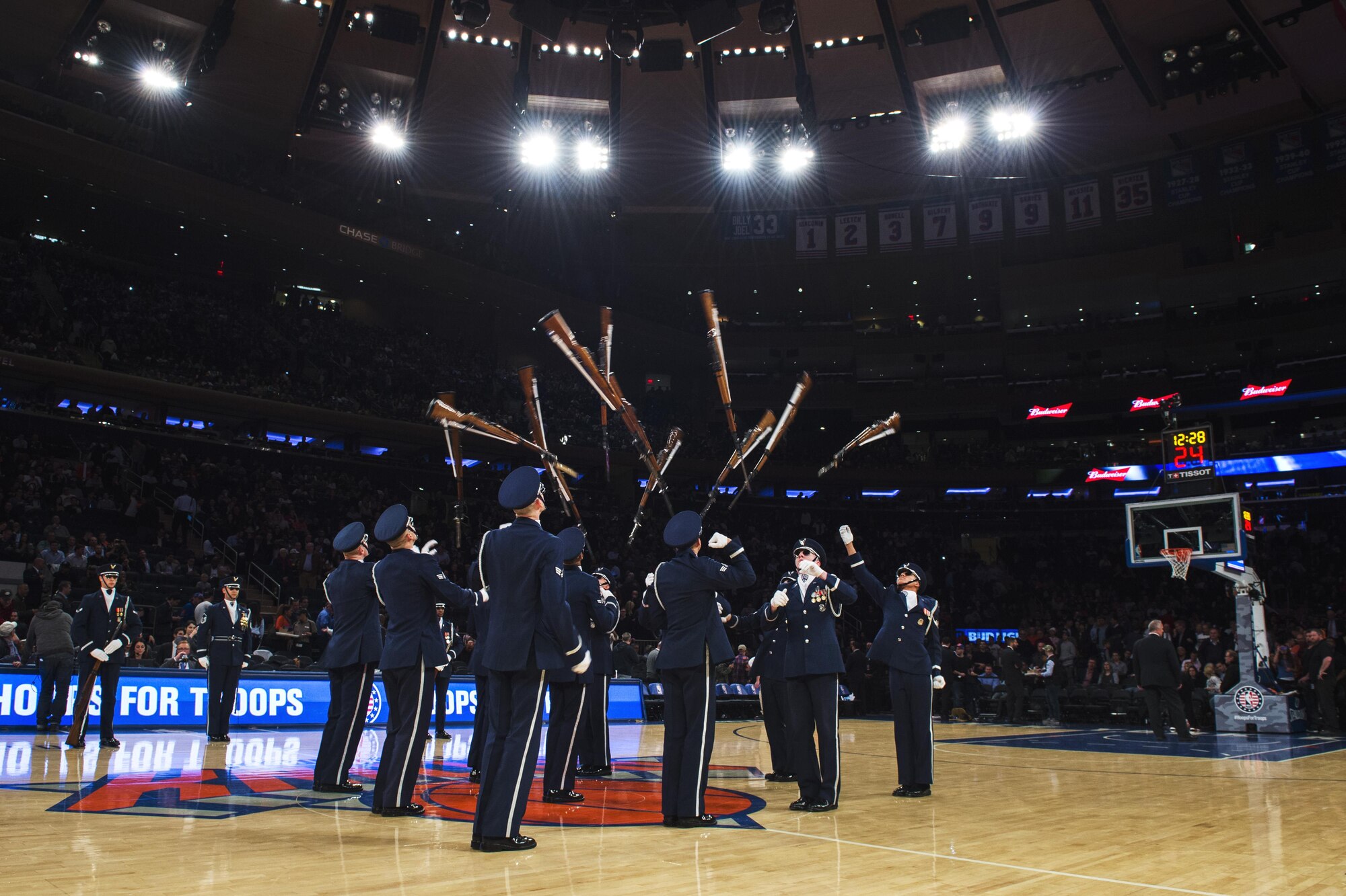 Members of the U.S. Air Force Honor Guard Drill Team perform a 12-man routine during halftime of the New York Knicks game at Madison Square Garden in New York, Nov. 9, 2016. The drill team showcased their skills in precision and weapon maneuvers in front of more than 19,000 people in the historic Madison Square Garden. (U.S. Air Force photo by Senior Airman Philip Bryant)