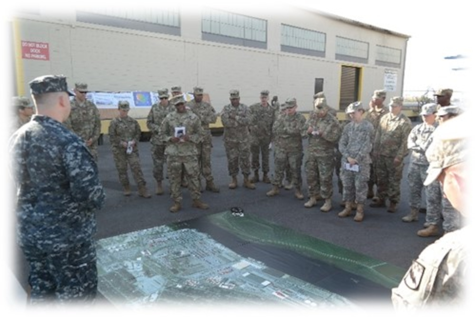 Lt. Col. Dennis Major, 841st Transportation Battalion commanding officer, briefs members of the 525th Military Intelligence Brigade on the capabilities of the Port of Wilmington, N.C. during a tactical exercise held Nov. 2, 2016 at Joint Base Charleston, S.C. Ninety company grade officers and NCO's traveled from Ft. Bragg, N.C. to participate in the exercise.
