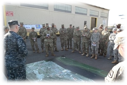 Lt. Col. Dennis Major, 841st Transportation Battalion commanding officer, briefs members of the 525th Military Intelligence Brigade on the capabilities of the Port of Wilmington, N.C. during a tactical exercise held Nov. 2, 2016 at Joint Base Charleston, S.C. Ninety company grade officers and NCO's traveled from Ft. Bragg, N.C. to participate in the exercise.
