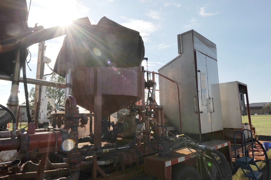 The batch plant, where iron and water are mixed, before being used for pneumatic fracturing, is covered by tarp, Nov. 8, 2016, at the fracturing site on the west side of Kansas Street, at McConnell AFB, Kan. The iron mixture is injected into the soil to break down ground water contaminants into non-hazardous by-products. (U.S. Air Force photo/2nd Lt. Carla Stefaniak)