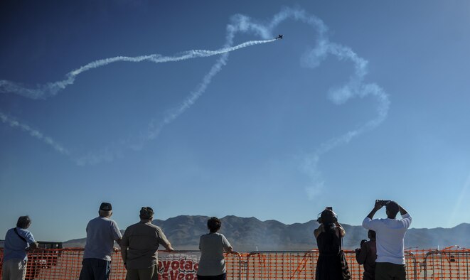 Spectators watch aerial demonstrations during the Aviation Nation air show on Nellis Air Force Base, Nev. Nov. 11, 2016. The air show, themed "75 Years of Air Power", gave more than 300,000 viewers the opportunity to see the Air Force's capabilities from the past and present. (U.S. Air Force photo by Airman 1st Class Kevin Tanenbaum/Released)