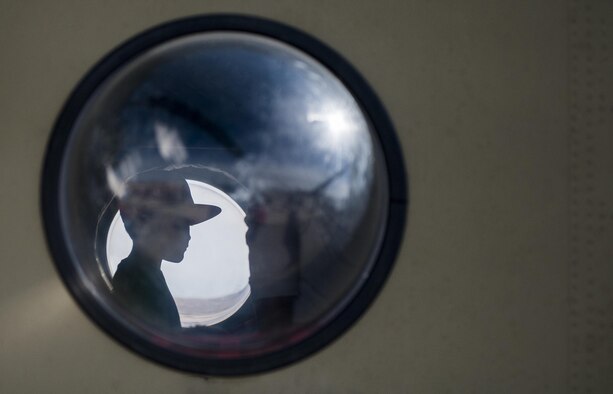 A child looks out the window of a CH-47 Chinook during the Aviation Nation air show on Nellis Air Force Base, Nev., Nov. 12, 2016. Aviation Nation played host to more than 300,000 spectators from the community, including media. (U.S. Air Force photo by Airman 1st Class Kevin Tanenbaum/Released)