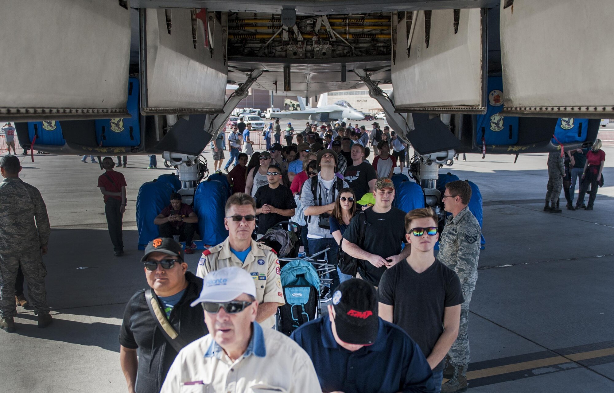 Spectators from the Aviation Nation air show wait in line to enter the cockpit of the B-1 Lancer on Nellis Air Force Base, Nev., Nov. 12, 2016. To strengthen this relationship, the 2016 Aviation Nation air show played host to a record number of attendees from all around the globe. (U.S. Air Force photo by Airman 1st Class Kevin Tanenbaum/Released)